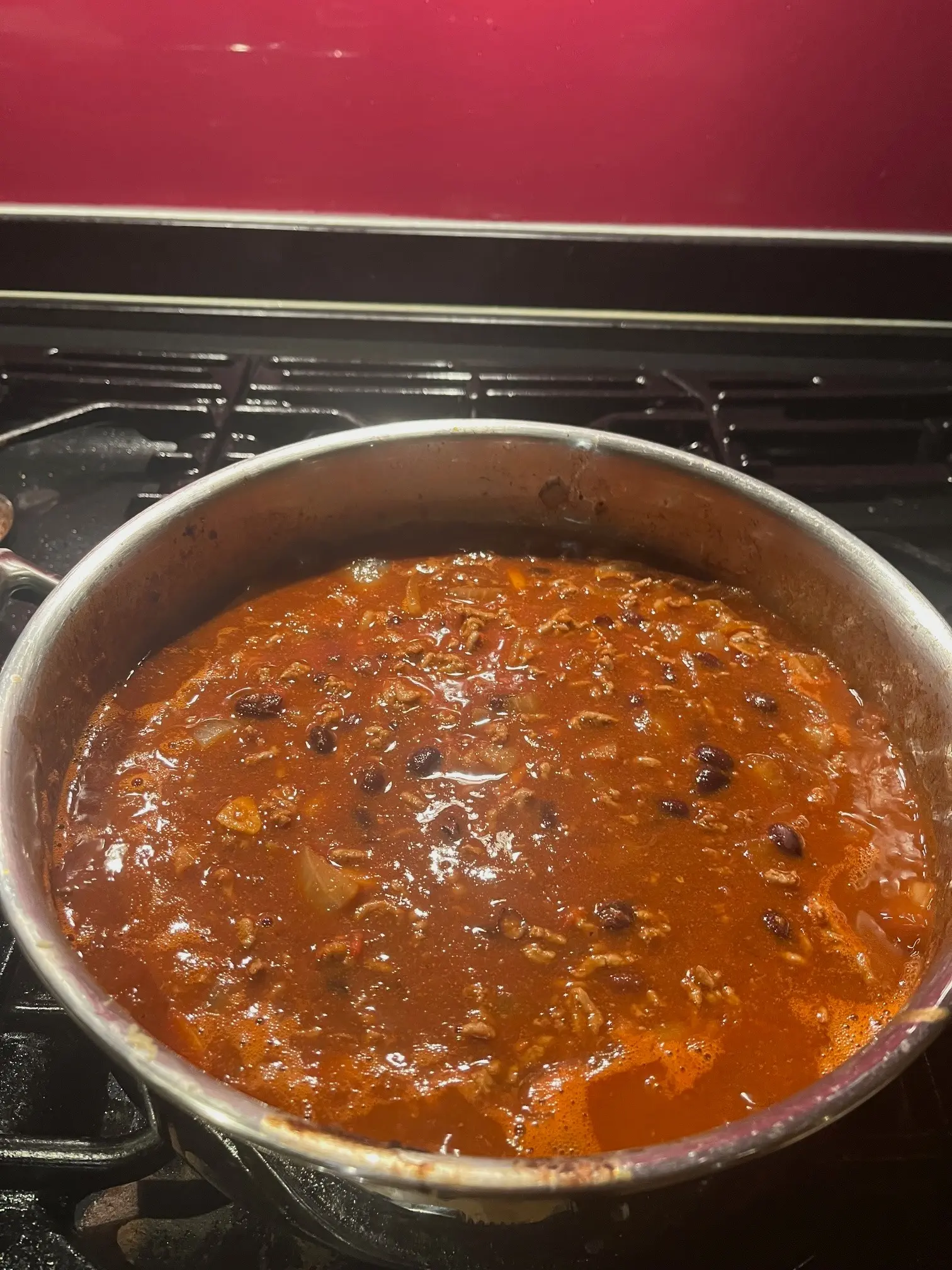 The chilli immediately after the tomatoes, coffee, beans and water have been added, before reducing