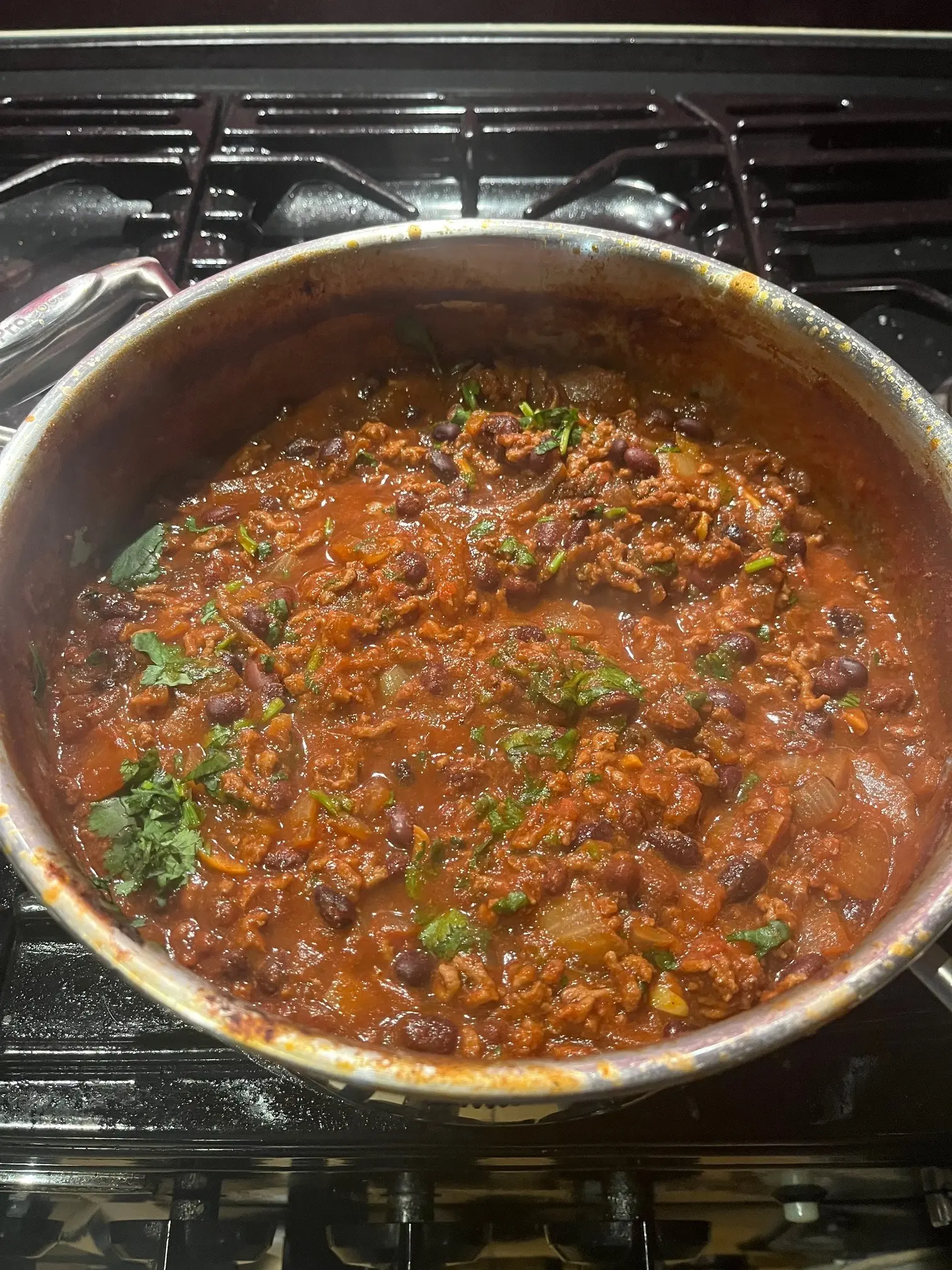 The reduced chilli, thick but still moist, with the sauce coating the mince and beans