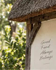 A close view of the cottage wall and thatch